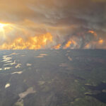 rain-not-forecasted-as-crews-battle-wildfire-burning-near-flin-flon,-manitoba.