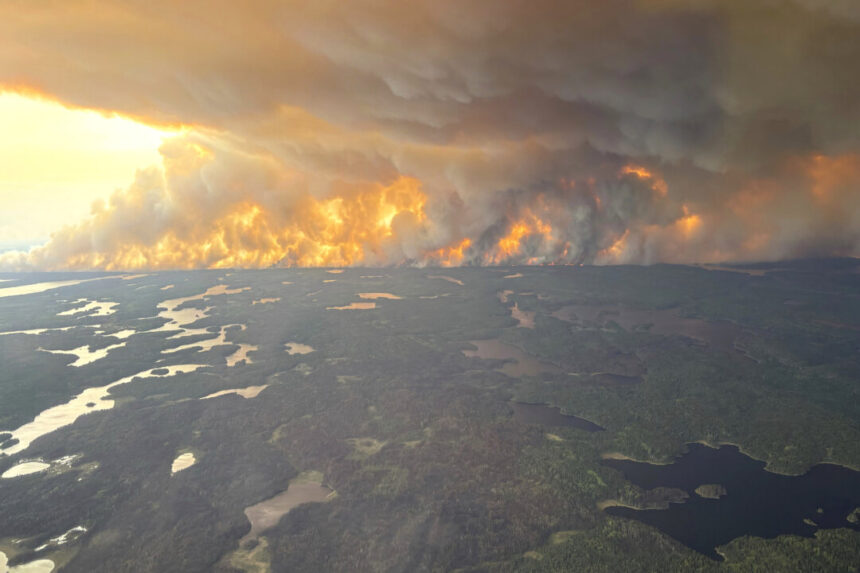 rain-not-forecasted-as-crews-battle-wildfire-burning-near-flin-flon,-manitoba.